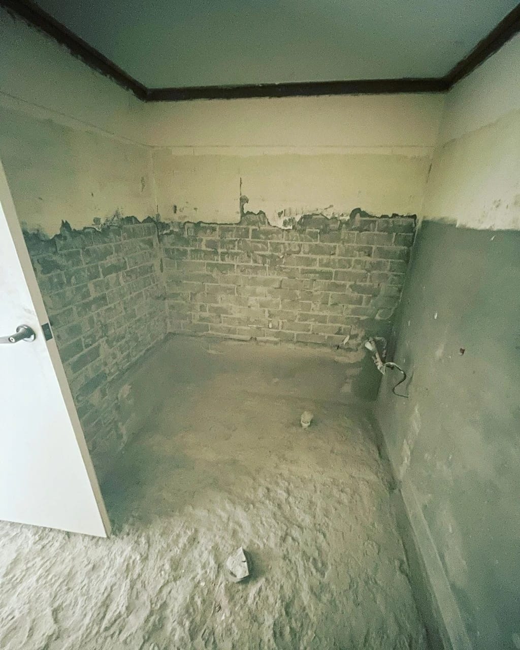 Same bathroom after the bath, vanity and surface finishes were removed