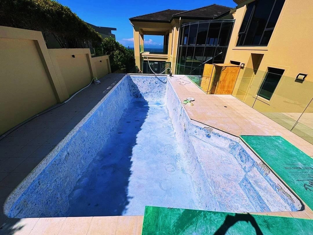 Same swimming pool after the interior surface was stripped back