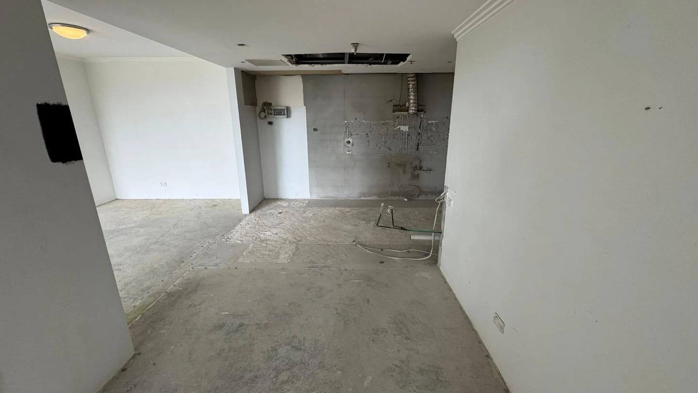 Apartment interior after the kitchen and floor finishes were removed