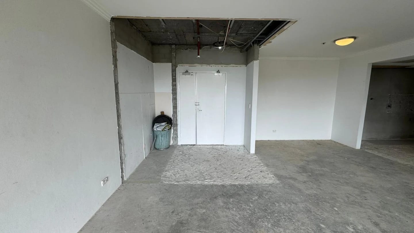 Apartment interior cleared around the retained lift doors and internal walls