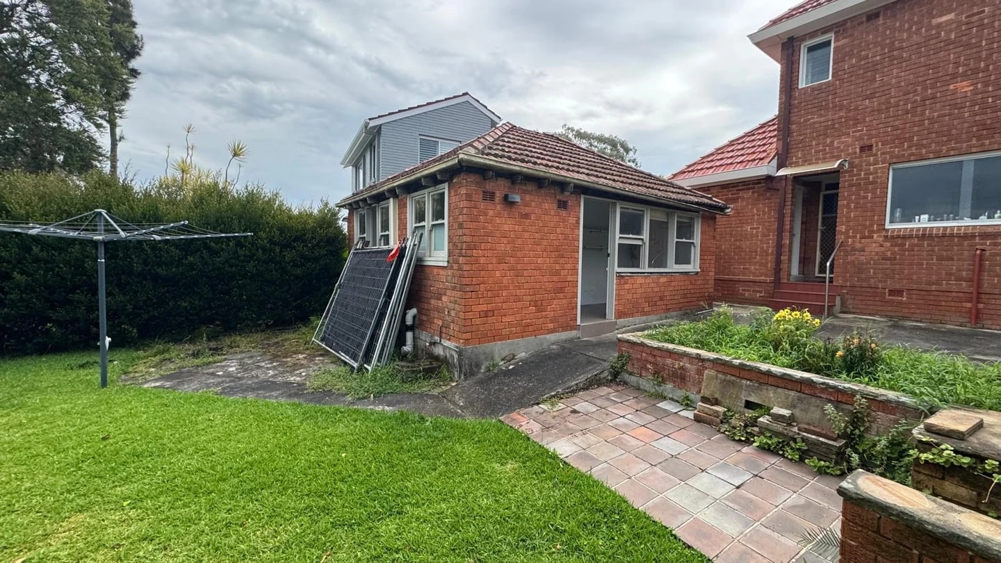 Residential yard after demolition of a detached brick garage
