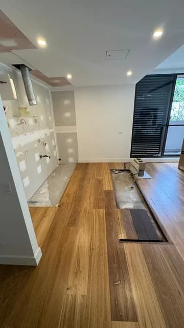 Bathroom stripped back to timber wall frames during an apartment strip out