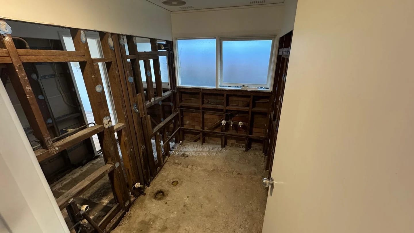 Bathroom stripped to timber framing and concrete substrate