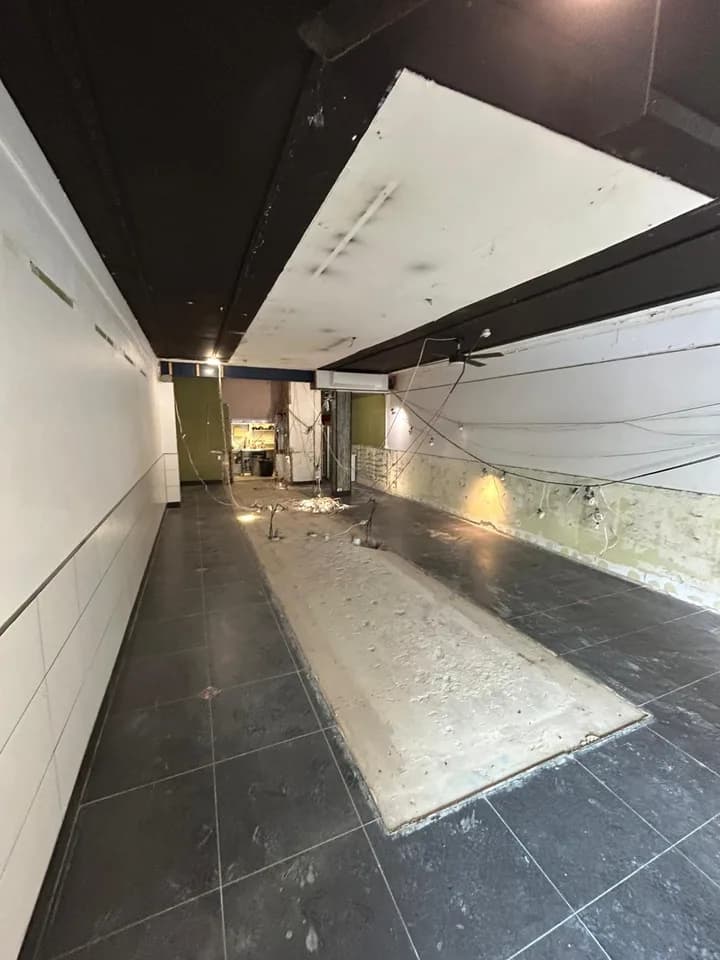Shop defit in progress with hospitality fit out stripped at Mona Vale