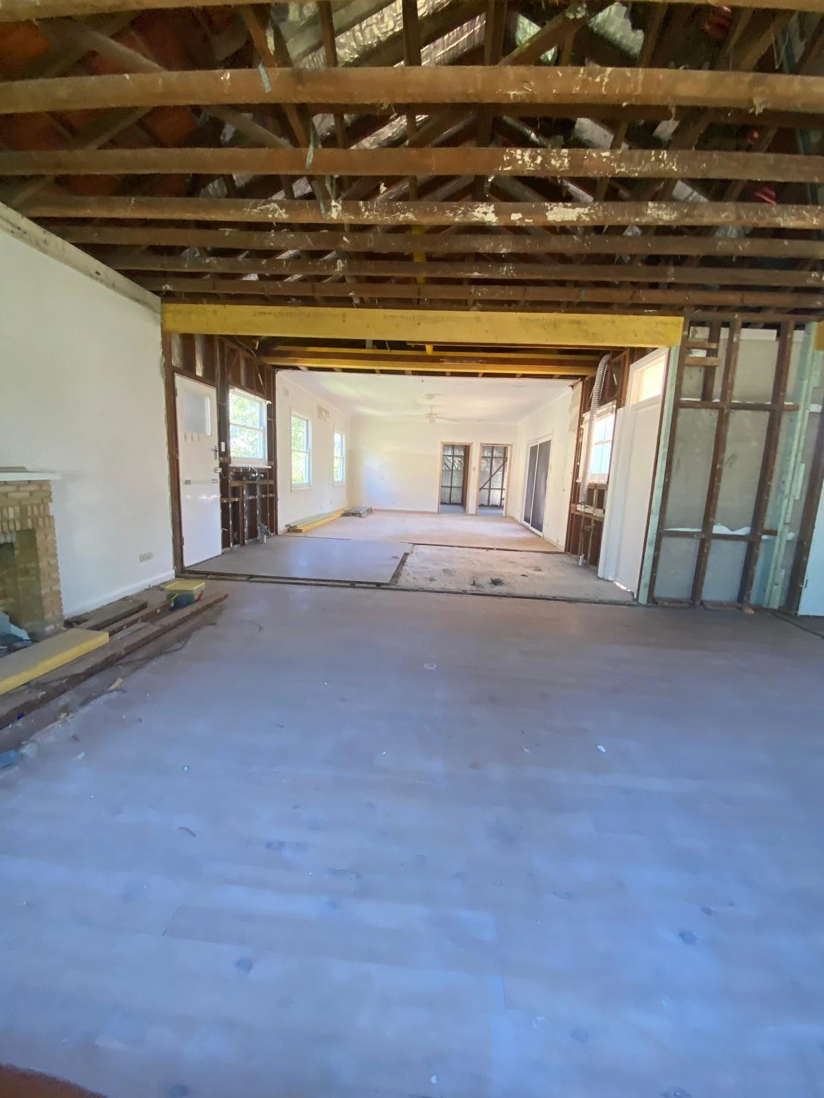 Opened interior with ceiling linings removed and roof framing exposed