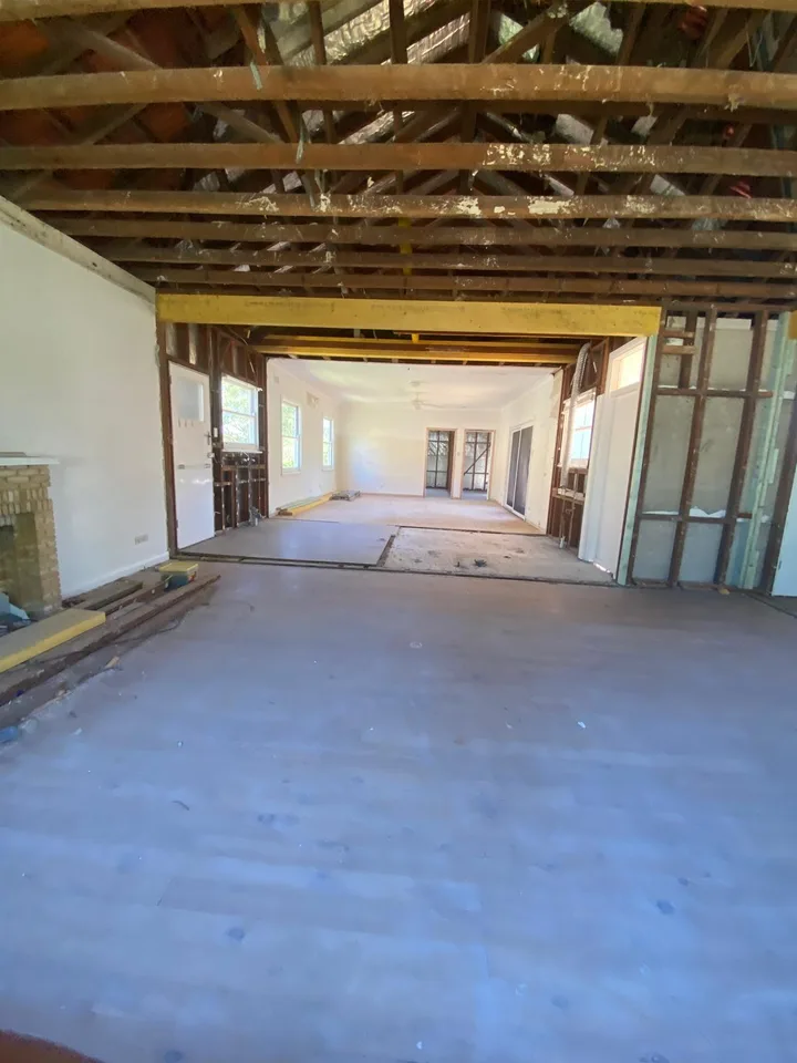 Open-plan space created after wall removal and beam installation
