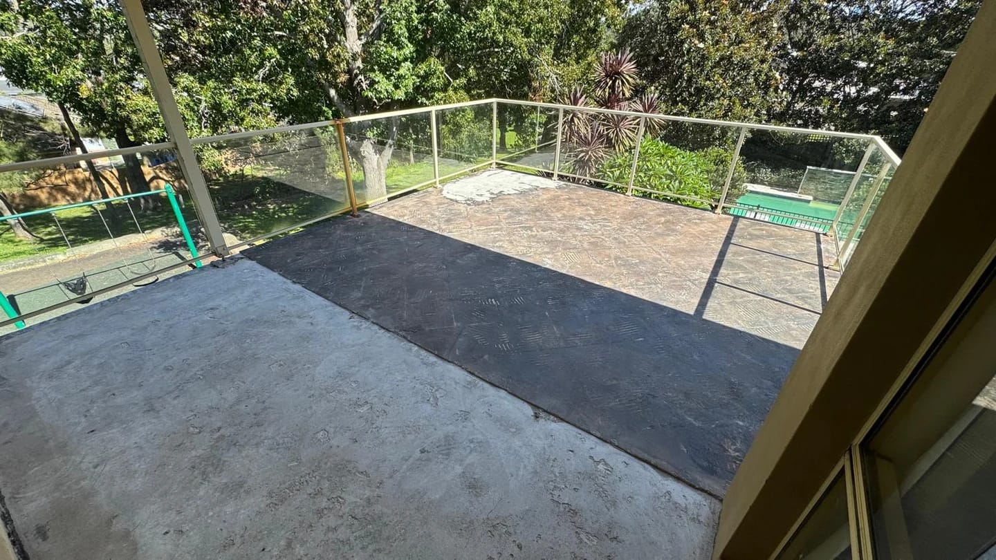 Balcony after tile removal with the glass balustrade retained