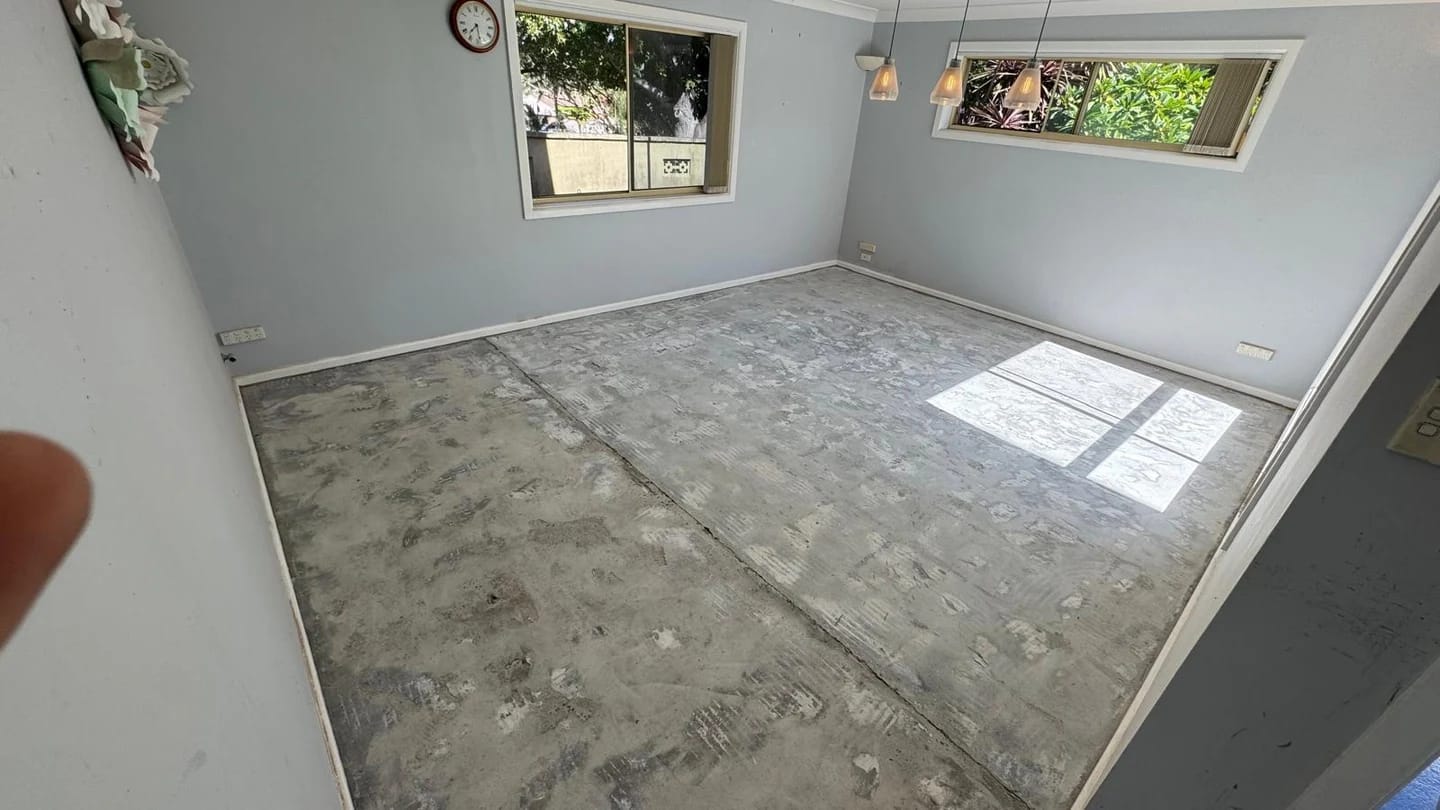 Internal room after floor tiles and adhesive were removed to expose the substrate