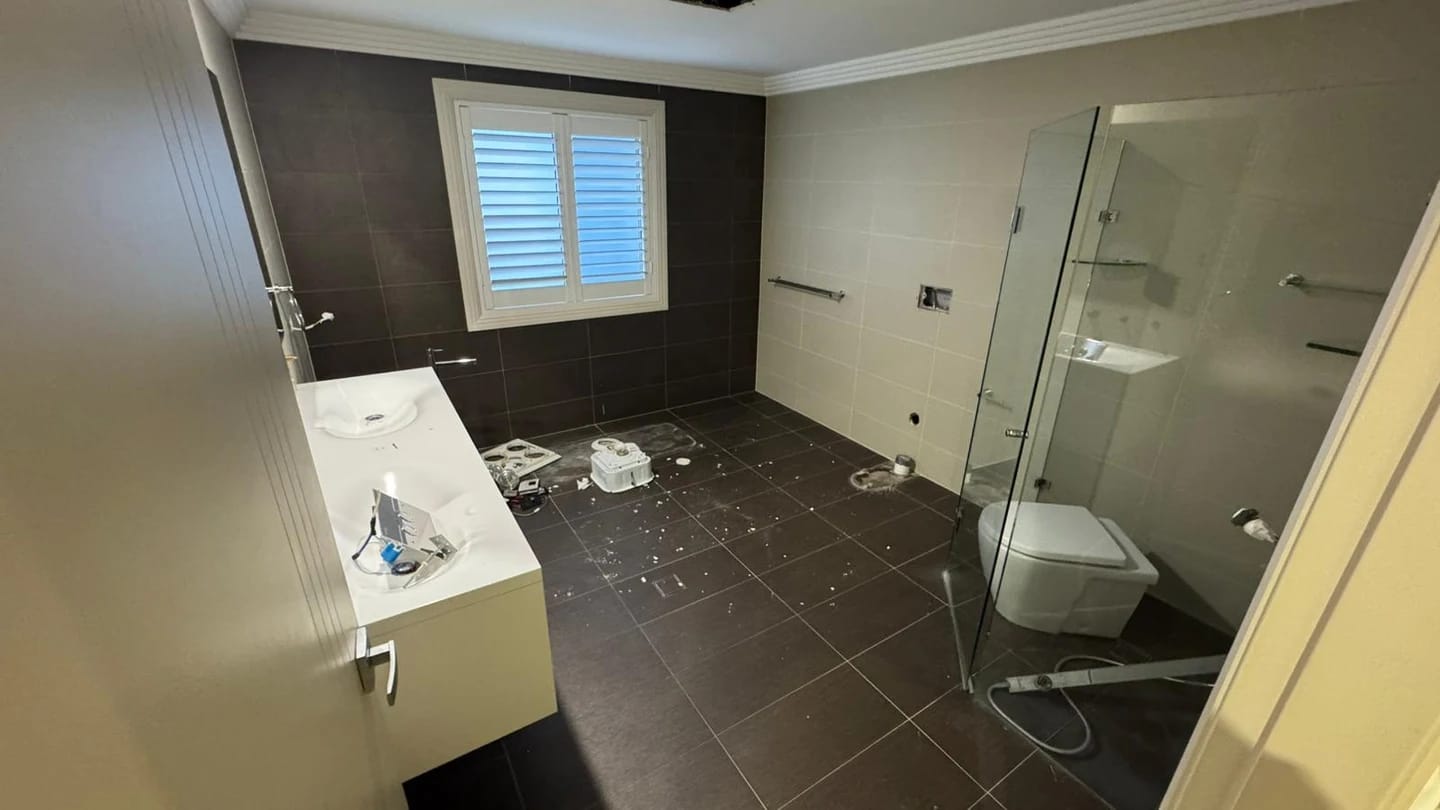 Residential bathroom stripped back to timber studs and floor substrate