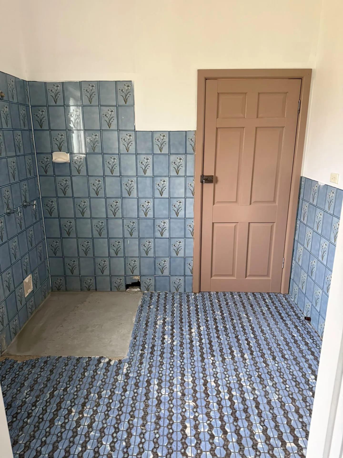 Blue-tiled Ryde bathroom before tile removal, with the vanity already removed