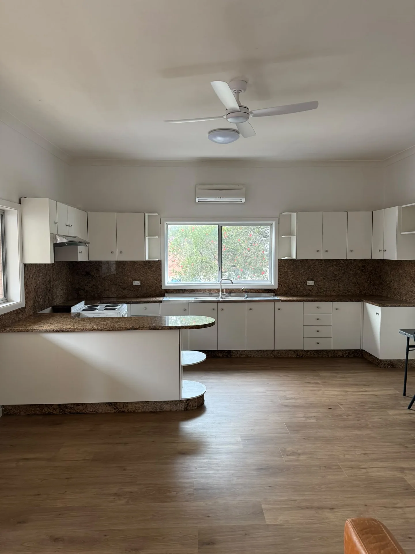 Ryde kitchen before strip out, with cabinetry, benchtops and splashback in place